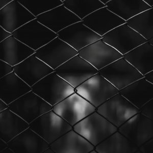 Black and White chainlink fence with blurry background